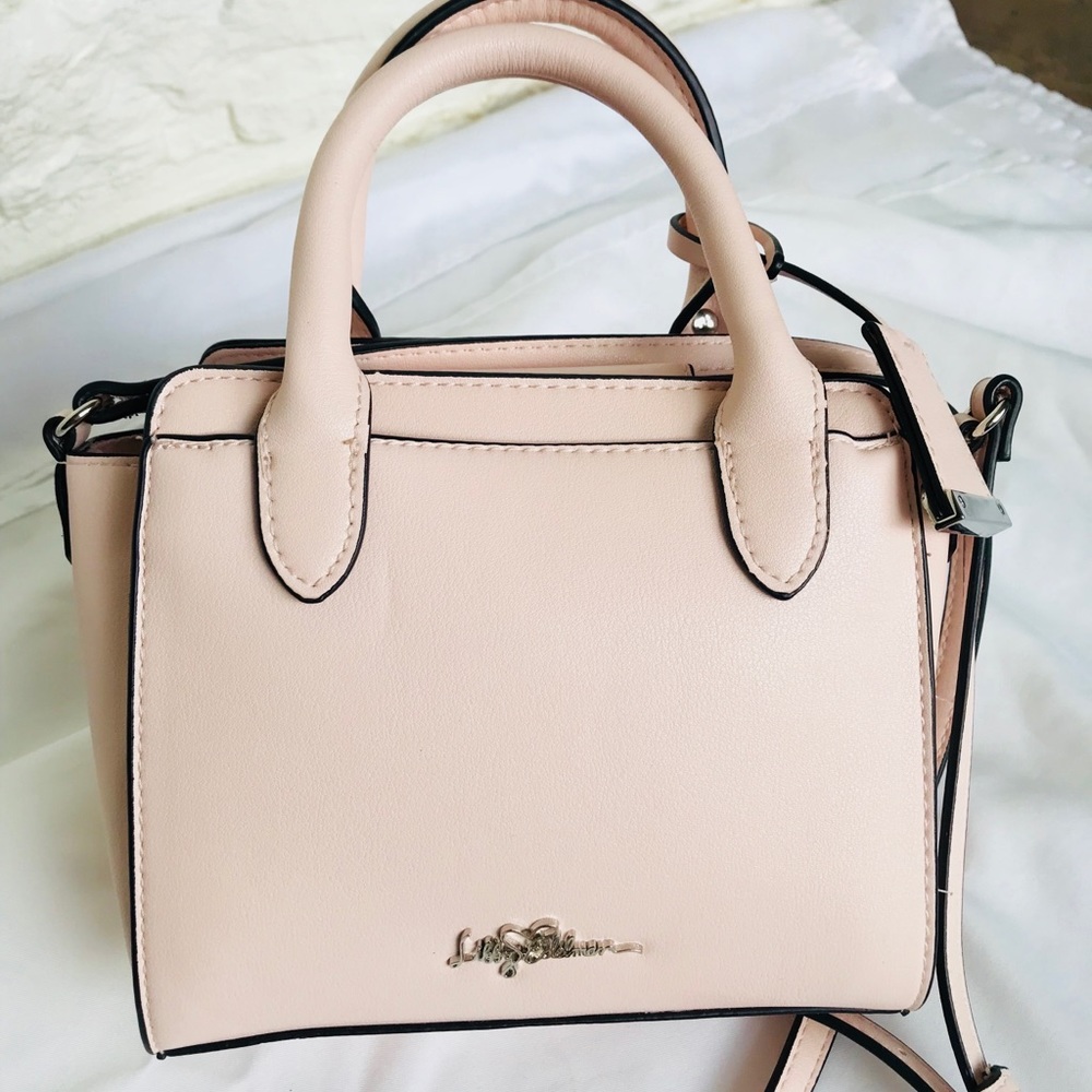 Libby Edelman pink crossbody bag.